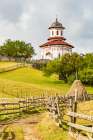 Romania, Transylvania, Carpathian Mountains. Hiking trails, fields. Village church. Art Print